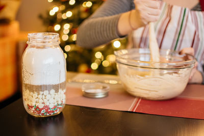 Midsection of woman preparing food in kitchen