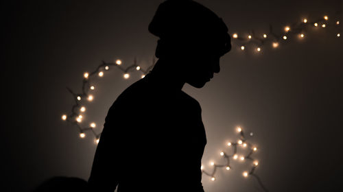 Silhouette man looking at camera