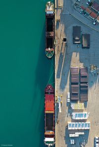 Directly above shot of pier by boats in sea