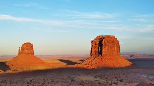 Rock formations on landscape against sky