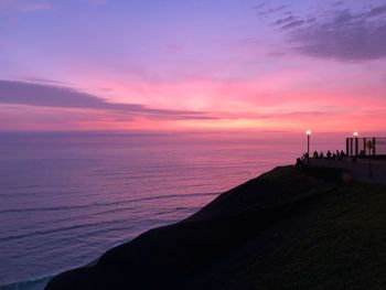 Scenic view of sea against orange sky