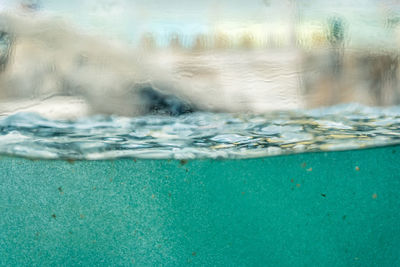 Close-up of water splashing in swimming pool