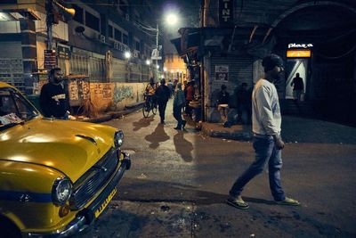 Blurred motion of people on road at night