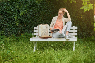 Woman sitting on grass