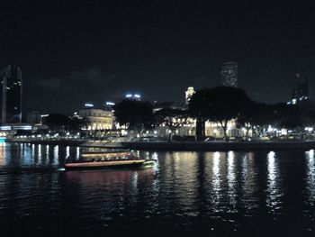 Illuminated city at waterfront