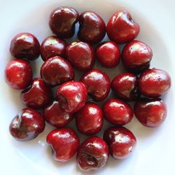 Close-up of cherries on white background