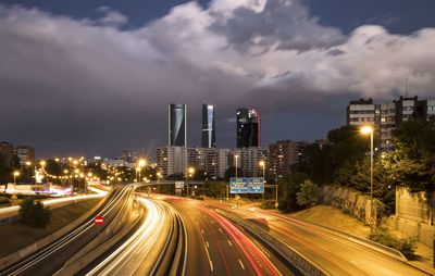 High angle view of light trails on road in city