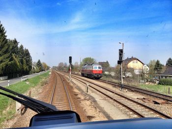 Railroad track seen through train windshield