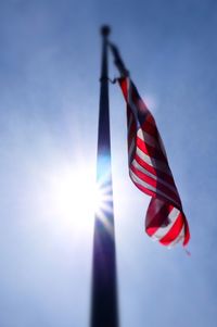 Low angle view of flag against sky