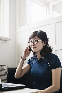 Woman on the phone in office