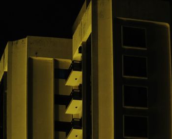 Close-up of yellow wall at night