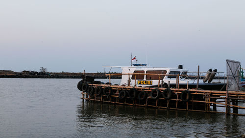 Ship on sea against clear sky