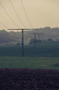 Electricity pylon on field