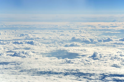 View of clouds as seen from an airplane window