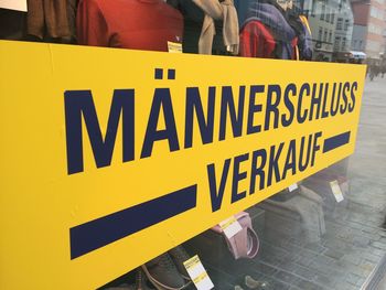 Close-up of yellow text in city