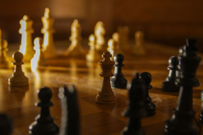 Close-up of chess pieces on table