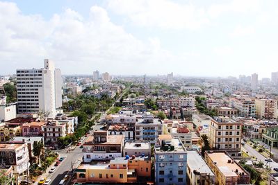 High angle view of buildings in city against sky