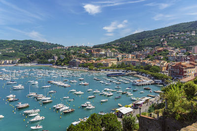 High angle view of river and townscape against seaport