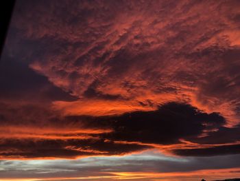 Low angle view of dramatic sky during sunset