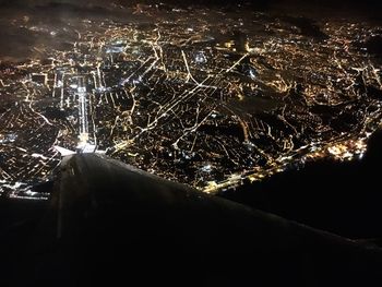 Close-up of illuminated water against sky at night