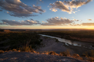 Scenic view of landscape against sky during sunset