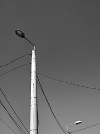 Low angle view of street light against clear sky