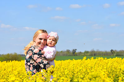 Low angle view of two girls in field