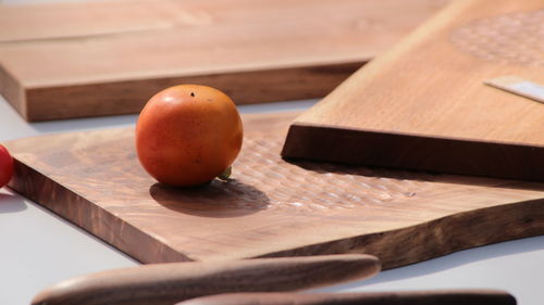 High angle view of oranges on cutting board