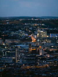 High angle view of illuminated buildings in city at night