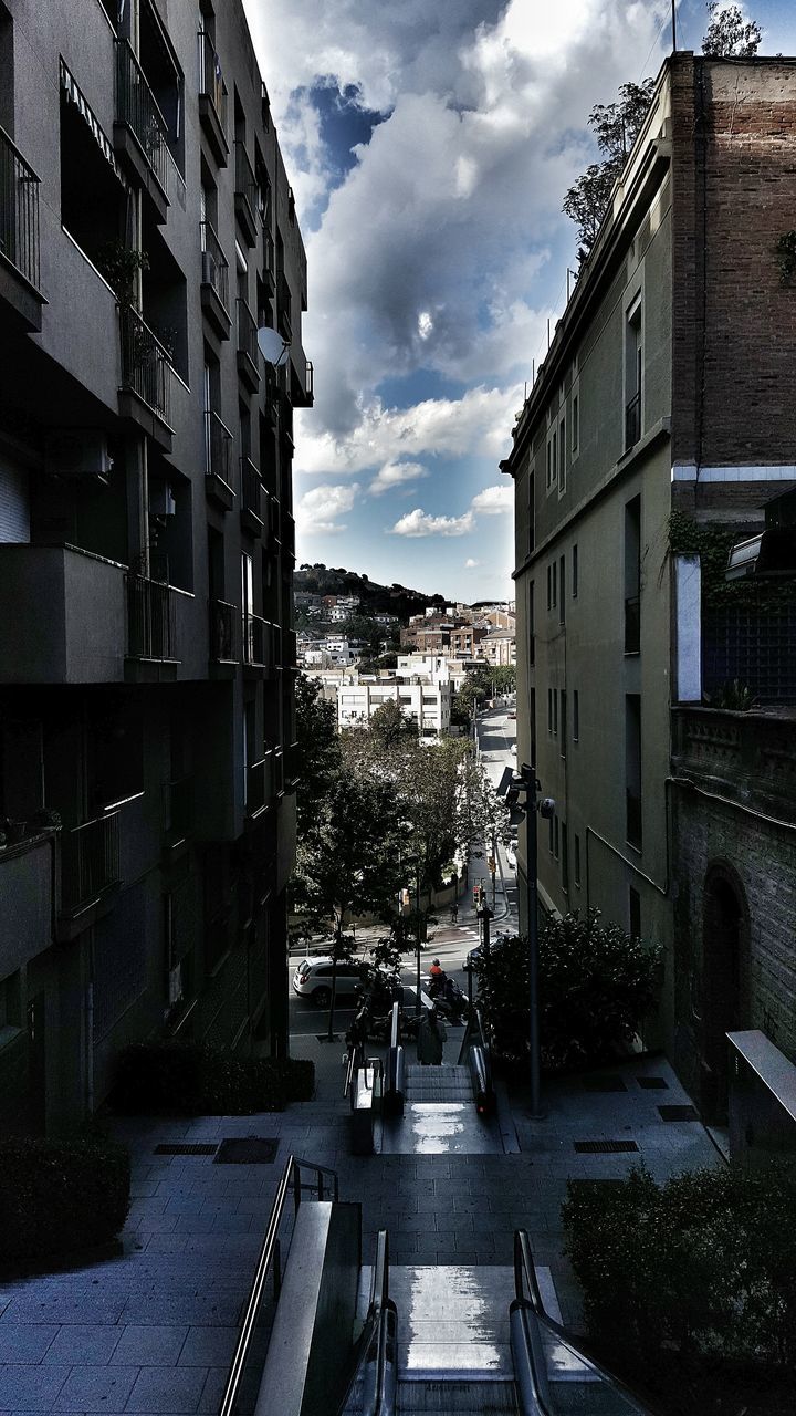 building exterior, architecture, built structure, city, sky, street, residential building, cloud - sky, residential structure, building, the way forward, residential district, road, cloud, day, city life, outdoors, cloudy, window, house