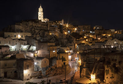 High angle view of illuminated buildings in city at night