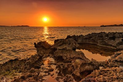 Scenic view of sea against sky during sunset