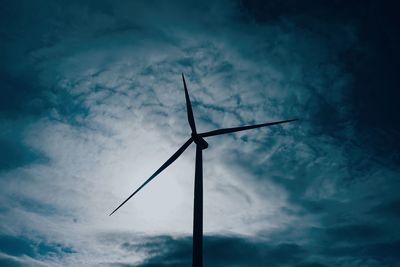 Low angle view of wind turbine against sky