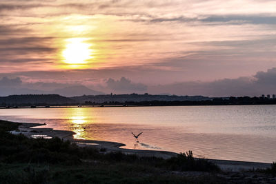 Scenic view of lake during sunset