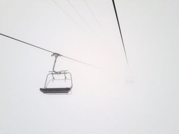 Overhead cable car against sky during winter