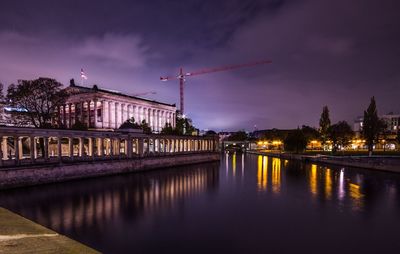 View of bridge over river at dusk