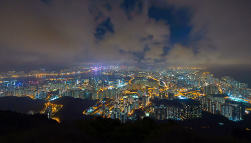 High angle view of illuminated buildings in city at night