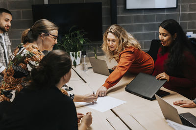 Coworkers having work meeting