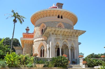 Low angle view of palace against blue sky