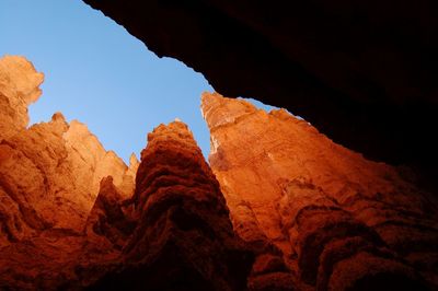 Low angle view of rock formation against sky