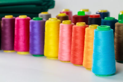 Close-up of multi colored toys on white background