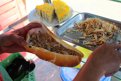 High angle view of man preparing food in plate