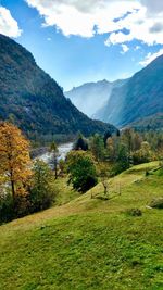 Scenic view of landscape and mountains against sky