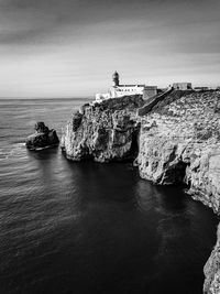 Scenic view of sea against sky and lighthouse. 