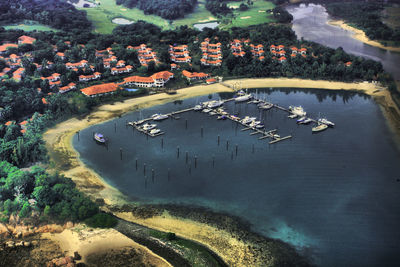 Aerial view of houses and lake in town