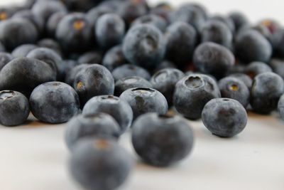 Close-up of blueberries against white background