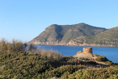 Scenic view of sea against clear blue sky