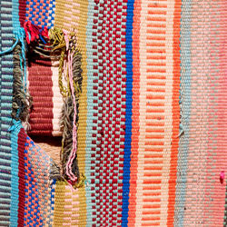 Rear view of woman wearing colorful mask for sale