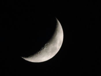 Low angle view of moon against clear sky at night