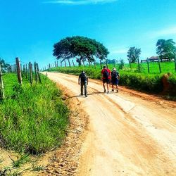 People riding bicycle on road